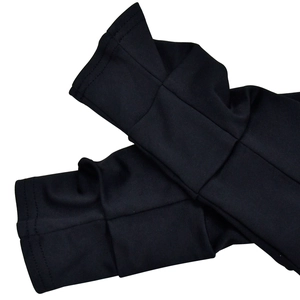 Detailed close-up of double-layered cuffs on a black sheer mesh dress with fine stitching