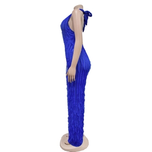 Detail of royal blue jumpsuit showing pleated ruffle texture and halter neck tie design