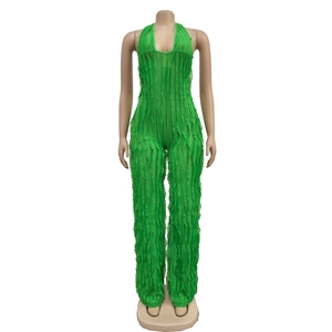 Detail view of lime green halter neck jumpsuit with sheer ruffles and pleated texture