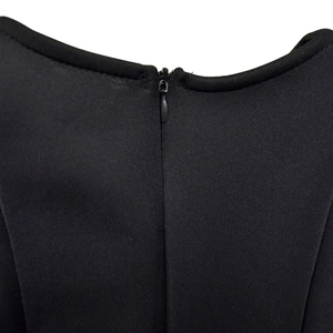 Close-up of black dress back neckline featuring high-quality invisible zipper detail