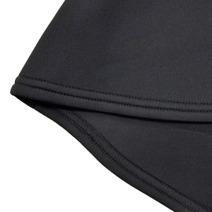 Detail of high-elasticity black fabric showing precise double-needle overlock stitching