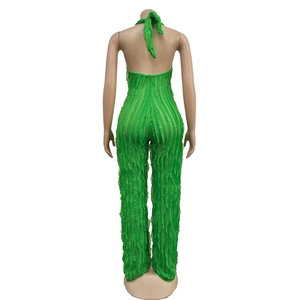 Close-up of backless halter jumpsuit in grass green with pleated ruffle details