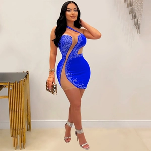 Detail of royal blue bodycon dress with silver rhinestones and sheer mesh panels