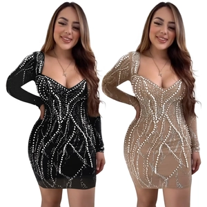 Detail of slim fit mini dress with long sleeves and wavy pearl beadwork in black and beige