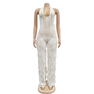 Detailed view of white backless halter jumpsuit with pleated texture and deep V-neckline