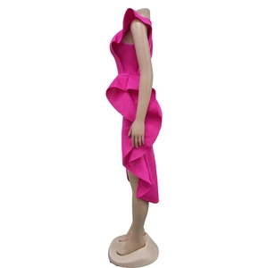 Detail of rose red one-shoulder dress featuring ruffled layers and irregular hemline