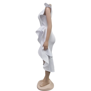 Detail of white ruffled off-shoulder dress with layered spiral pleats and irregular hem