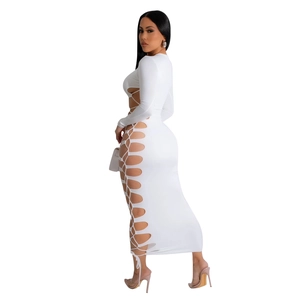 Detailed close-up of side cut-out design with lace-up ties on white slim maxi dress