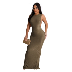 Detail of shimmering gold backless maxi dress featuring sparkling sequin texture