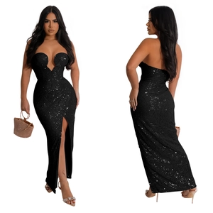 Detailed view of black sequined dress featuring a high slit and deep V-neck design