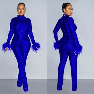 Royal blue sequined long sleeve bodysuit with feather cuffs and geometric patterns