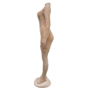 Detail of nude mesh mini dress with sparkling silver rhinestones and pearls pattern
