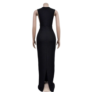 Detail of elegant backless black maxi dress featuring high slit and slim fit silhouette