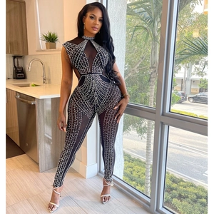 Women's black mesh jumpsuit featuring silver rhinestones and a high-neck sleeveless design