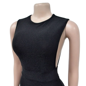 Detail of shimmer black sleeveless dress showing side cutout design and glitter texture