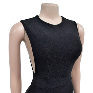 Close-up of black sleeveless slim-fit garment with shimmering glitter fabric texture