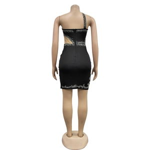 Detail view of black bodycon dress with silver rhinestones and mesh waist cutouts