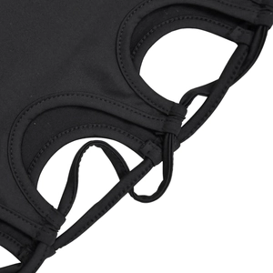 Detailed close-up of a black dress featuring hollow-out cutouts and fine cross-string details