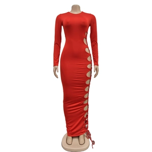Macro detail of red long sleeve dress featuring sexy side cut-out design with round neck