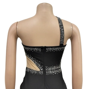 Detail of rhinestones on back and side mesh panel of the black one-shoulder dress