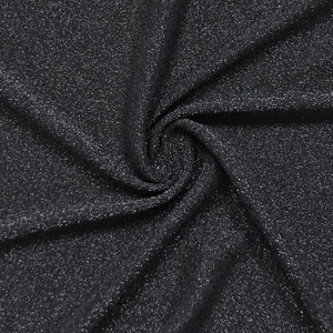 Macro shot of shimmering black glitter fabric with silver sequins and metallic texture