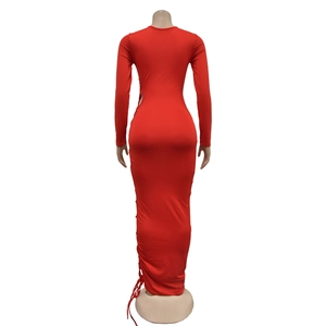 Detail view of the red maxi bodycon dress featuring side hollow out and lace-up design