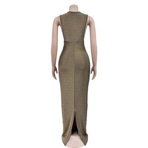 Detail view of back slit and metallic bronze fabric on a sleeveless maxi dress