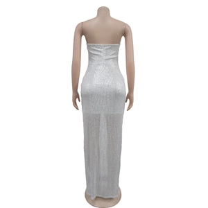 Detail of shimmering silver sequins on a sexy backless floor-length evening gown