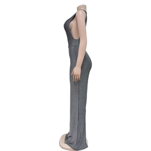 Detail view of the deep grey sequin fabric and side cutout design on a slim maxi dress