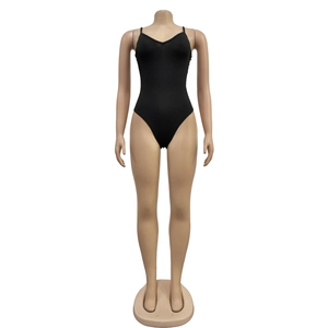 Detail view of black V-neck bodysuit with thin straps and high-cut elastic fabric