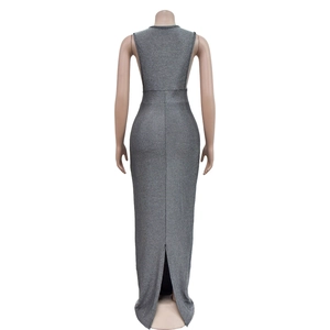 Detail view of silver sleeveless sequined long dress featuring an open back and high slit