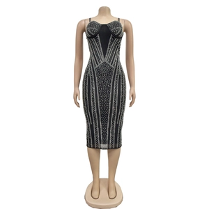 Detailed view of black bodycon dress with silver rhinestones in radial geometric pattern