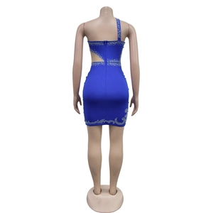 Detail of royal blue bodycon mini dress featuring silver rhinestones and back zipper