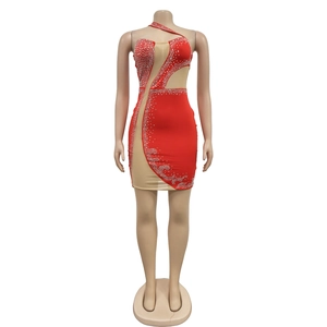 Detail of red mesh mini dress featuring sparkly rhinestones and sheer mesh panels