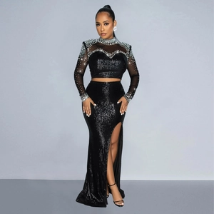 Detail of the mesh neckline with silver rhinestones and black sequins on the dress set