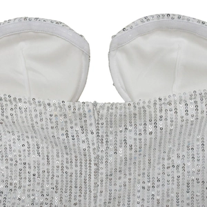 Detail of white sequin dress with built-in bra cups and non-slip silicone strips