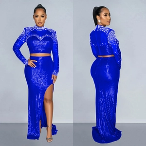 Elegant royal blue sequin two-piece gown set with beaded collar and high slit skirt