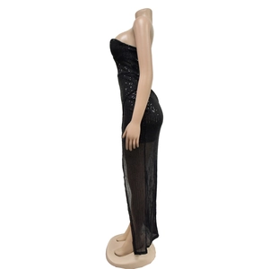 Detail of black sequined evening dress with sheer striped hem and side view silhouette