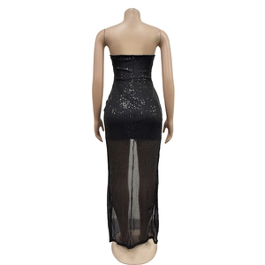Macro shot of black sequin bodycon dress back featuring a sheer mesh mermaid hemline