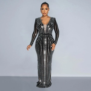 Detail of elegant black deep V-neck dress with sparkling silver rhinestone stripes