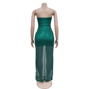Detailed back view of emerald green sequin dress with sheer tulle hem and zipper