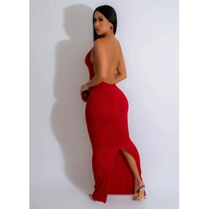 Detail of red backless halter dress featuring shimmering fabric and elegant back slit