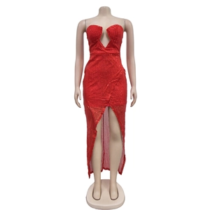 Detail of red sequin dress with deep V-neckline and sparkling textured fabric finish