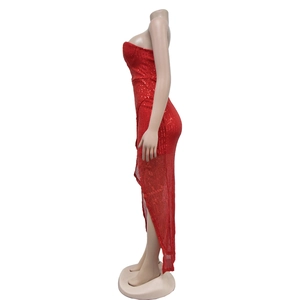 Detail of red sequin strapless dress with irregular high-low hem and shimmering texture