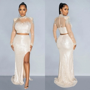 Detailed view of white mesh sequin top and high-slit long skirt two-piece set