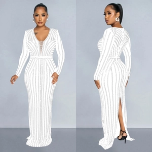 Elegant white long sleeve evening dress with sparkling rhinestones and a deep V-neck design