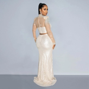 Detail of champagne two-piece sequin evening set with mesh long sleeves and beads