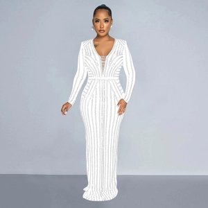 Detail of white long sleeve gown with silver rhinestone vertical patterns and deep V-neck