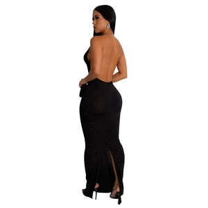 Close-up of the backless detail and shimmering fabric on this black evening dress