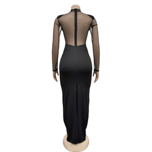 Detail view of the black mesh sleeves and back zipper closure on the slim fit maxi dress